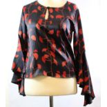 ALLEGRA HICKS, BLACK SILK SATIN SHIRT With red floral design and circular flounce sleeve (size