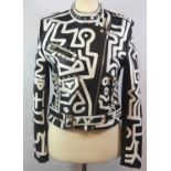 NEVADA, BLACK LEATHER JACKET With painted white designs throughout, zip up pockets, flat studs along