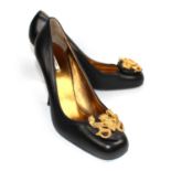 MIU MIU, BLACK LEATHER HEELS With gilt metal crest to front depicted with a crown and shield flanked