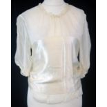 MORGANE LE FAY, CREAM SILK BLOUSE With ruffled design, mid length sleeves, fabric belt (size S). A