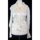 ALEXANDER MCQUEEN, WHITE SILK SHIRT With ruffled cuffs and collar and a U neckline (size 42). A