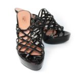 ALAÏA, PATENT LEATHER HEELS With lattice strapwork and tapering heel (size 39). (heel 12cm) A