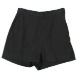KATHARINE HAMNETT, BLACK WOOL SHORTS With side zip, skirt appearance (size M). A