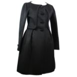 VALENTINO, BLACK WOOL COAT With slight pleated sides, long sleeves, large black buttons along