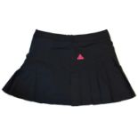 PEAK, BLACK POLYESTER TENNIS SKIRT With side pleats, pink logo, back zip and sewn in stretch