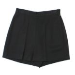 KATHARINE HAMNETT, BLACK WOOL SHORTS With slight pleats, skirt appearance, side zip (size M). A