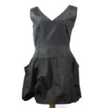 PRADA, BLACK SILK DRESS With pockets along skirt, deep v-neckline, sleeveless, slight pleated