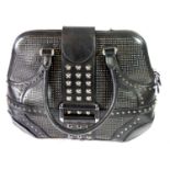 ALEXANDER MCQUEEN, BLACK LEATHER HANDBAG Covered in silver pointed and flat studs, silver zipper