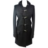 BALENCIAGA, BLACK WOOL COAT With silver 'tooth' fascinators, hood, front pockets (size 40). A