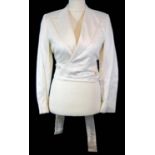 GUCCI, CREAM SILK BLAZER With peak lapel collar and three faux front pockets (size 40). A