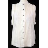 B.L. PHILLIPHINE, WHITE POLYESTER SHIRT With black sphere buttons, sleeveless (size 6). B