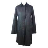 KAREN WALKER, BLACK COTTON COAT With rounded collar, hidden buttons along middle and four large