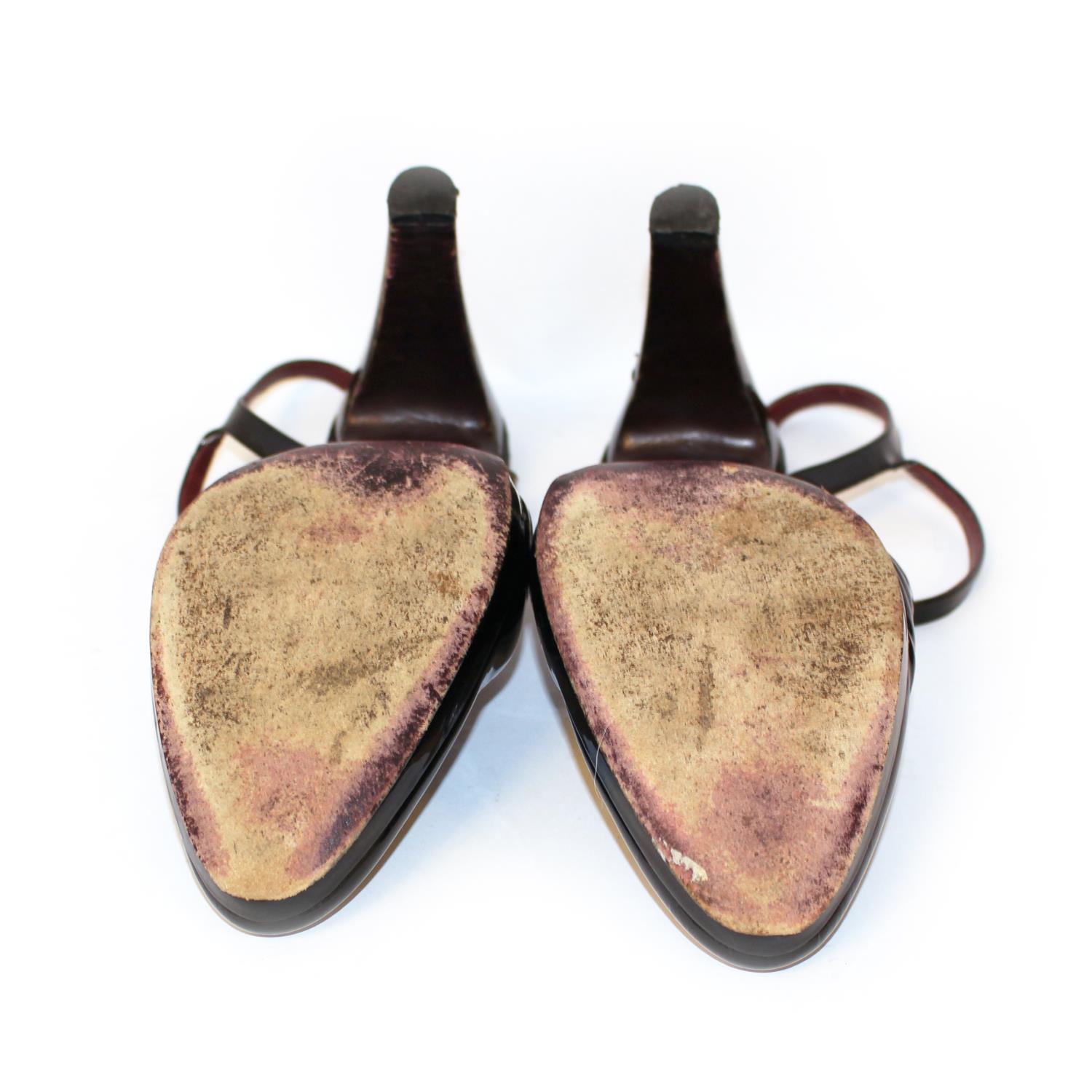 PRADA, BLACK PATENT LEATHER HEELS The heel strap with gilt metal buckles (size 39.5). (heel 11cm) B - Image 4 of 5