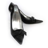 DOLCE & GABBANA, BLACK SUEDE HEELS With leather bow above a pointed toe (size 39). (heel 9cm) C