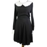 COCO FENNELL, BLACK RAYON DRESS With white Peter Pan collar, white cuffs and slight pleated skirt (