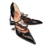 ALAÏA, BLACK LEATHER HEELS With a pointed toe, four crossover straps with triangular buckles (size