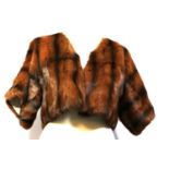 DOLCE & GABBANA, RED SQUIRREL FUR SHOULDER JACKET With cream silk lining, open front (size 42). A