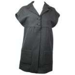 BALENCIAGA, BLACK WOOL COAT With black silk lining, sewn up front, notch lapel collar, and cap