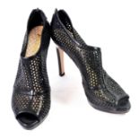 PRADA, BLACK LEATHER HEELS With honeycomb cut out pattern, back zip, open toe (size 38½). (heel 11.