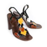 MIU MIU, PATENT LEATHER PLATFORM SANDALS With a frontal mustard, brown and black geometric design, a