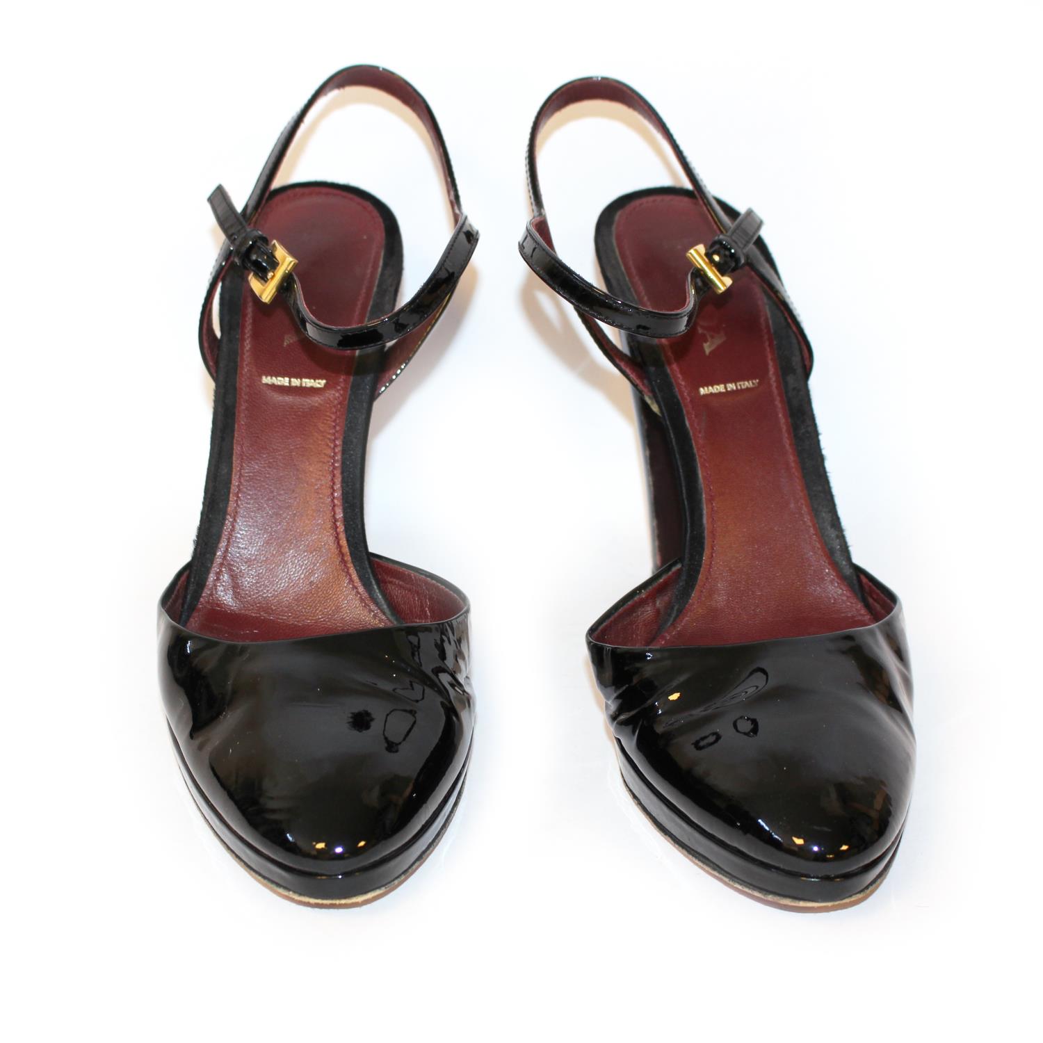 PRADA, BLACK PATENT LEATHER HEELS The heel strap with gilt metal buckles (size 39.5). (heel 11cm) B - Image 2 of 5