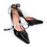 STEPHANE KÉLIAN, BLACK LEATHER HEELS With a back stitched cross design, leather tassel ankle