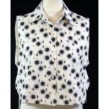 ALAÏA, BLACK AND WHITE COTTON DAISY PRINTED BLOUSE (size French 42). B