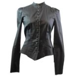 BETSEY JOHNSON, BLACK COTTON JACKET With ruffled shoulders, asymmetric hem and small buttons along