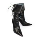 CHRISTIAN LOUBOUTIN, BLACK LEATHER LACE UP BOOTS With decorative perforations (size 39). (heel 10.