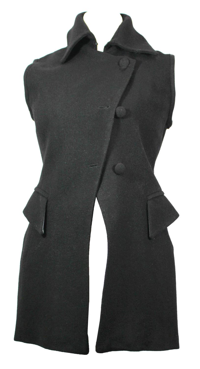 SELINA BLOW, BLACK 'WOOL' COAT With two front pockets, sleeveless, pointed collar, black 'silk'