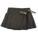 BURBERRY, BLACK WOOL SKIRT With pleated design and two side buckles (size 10). A