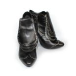 ALEXANDER MCQUEEN, BLACK LEATHER ANKLE BOOTS With side zip and three front leather flaps covering