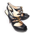 PRADA, BLACK LEATHER PEEP TOE HEELS With three buckled straps (size 38.5). (heel 12cm) B