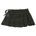 BURBERRY, BLACK WOOL SKIRT With pleated design and two black side belt buckles (size 10). C