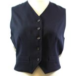 DKNY, BLACK WOOL WAISTCOAT With cream and grey striped rayon back and lining and brown buttons along