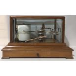 AN EARLY 20TH CENTURY MAHOGANY AND BRASS BAROGRAPH Having four bevelled glass panels to lid, brass