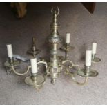 A SILVERED BRONZE SIX BRANCH CHANDELIER Having embossed decoration with six scrolled arms and