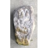 A RECTANGULAR CARVED STONE CORBEL Carved with a crowned Medieval portrait and crucifix to base. (