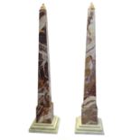 A LARGE PAIR OF ITALIAN VARIEGATED ROUGE MARBLE OBELISKS On a stepped grey marble base. (approx