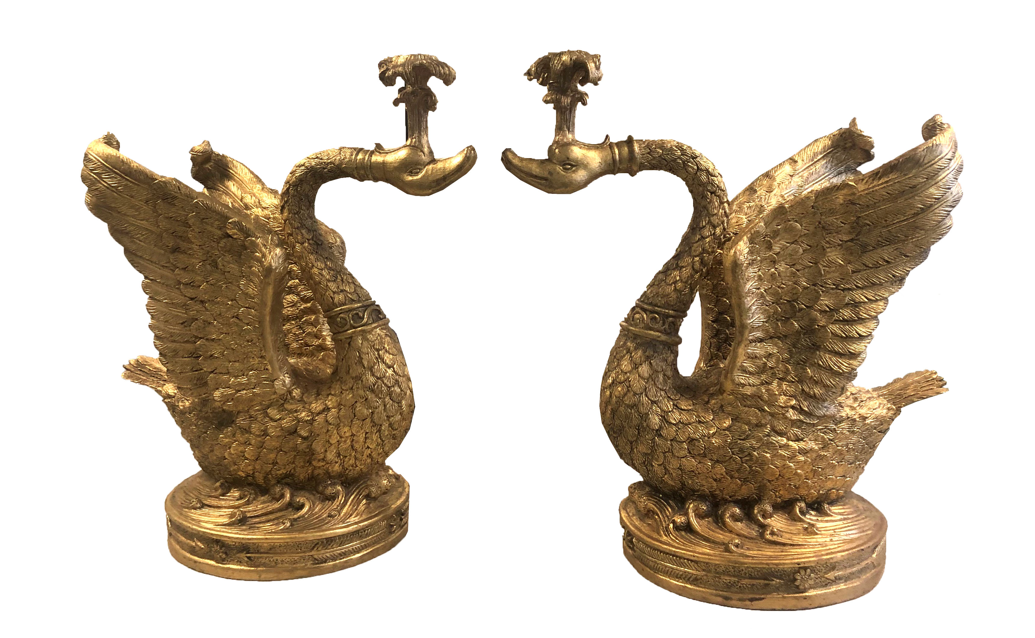 ORIEL HARDWOOD, A PAIR OF GILDED TERRACOTTA CANDELABRA IN THE FORM OF CLASSICAL SWANS. (64cm x 40cm)