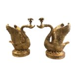 ORIEL HARDWOOD, A PAIR OF GILDED TERRACOTTA CANDELABRA IN THE FORM OF CLASSICAL SWANS. (64cm x 40cm)