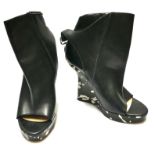 JEAN-PAUL GAULTIER, A PAR OF BLACK AND WHITE LEATHER OPEN TOE WEDGE ANKLE BOOTS (size 39).