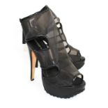 AMANDA GREGORY, BLACK LEATHER PEEP TOE HEELS With gold circular panels to sides (size 38). (heel