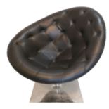 A LEATHER BUTTON BACK UPHOLSTERED CHAIR On chrome revolving base. (95cm x 96cm)