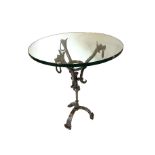 A POLISHED STEEL CAFÉ TABLE The circular plate glass top on a polished steel and aluminium base,