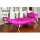 MARK BRAZIER-JONES, B. 1956, JABA DAYBED Upholstered in a bright pink button back cow hide, raised