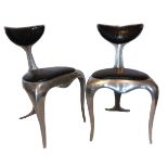 MARK BRAZIER-JONES, B. 1956, A PAIR OF LIMITED EDITION POLISHED ALUMINIUM DOLPHIN TAIL CHAIRS