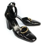 STEPHANE KÉLIAN, BLACK PATENT LEATHER SANDALS With a gold central buckle, ankle strap, wedged