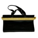 KARL LAGERFELD, BLACK PATENT LEATHER HANDBAG With gilt metal band clasp, complete with