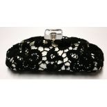 CHANEL, A BLACK AND WHITE COTTON AND SATIN FLORAL LACE LARGE FRAMED CLUTCH With lucite monogrammed